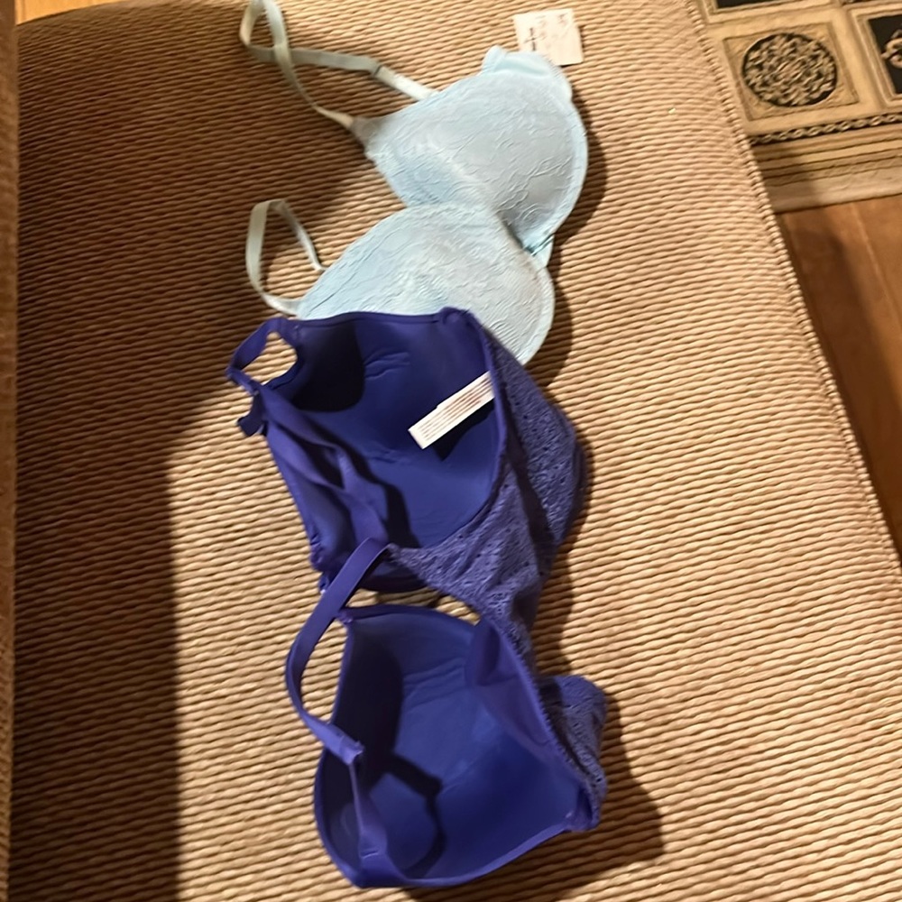 2 bras, light blue brand new (34c) , dark blue racer back (34DD)